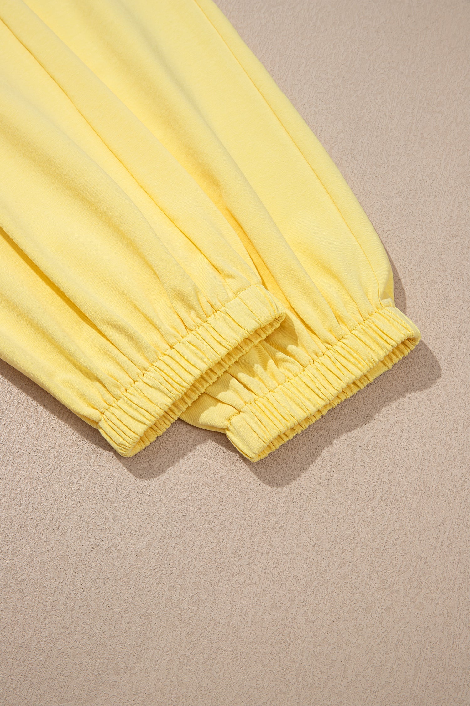 Solid Cropped Cream Cropped Tank Top and Jogger Pants Set in Yellow