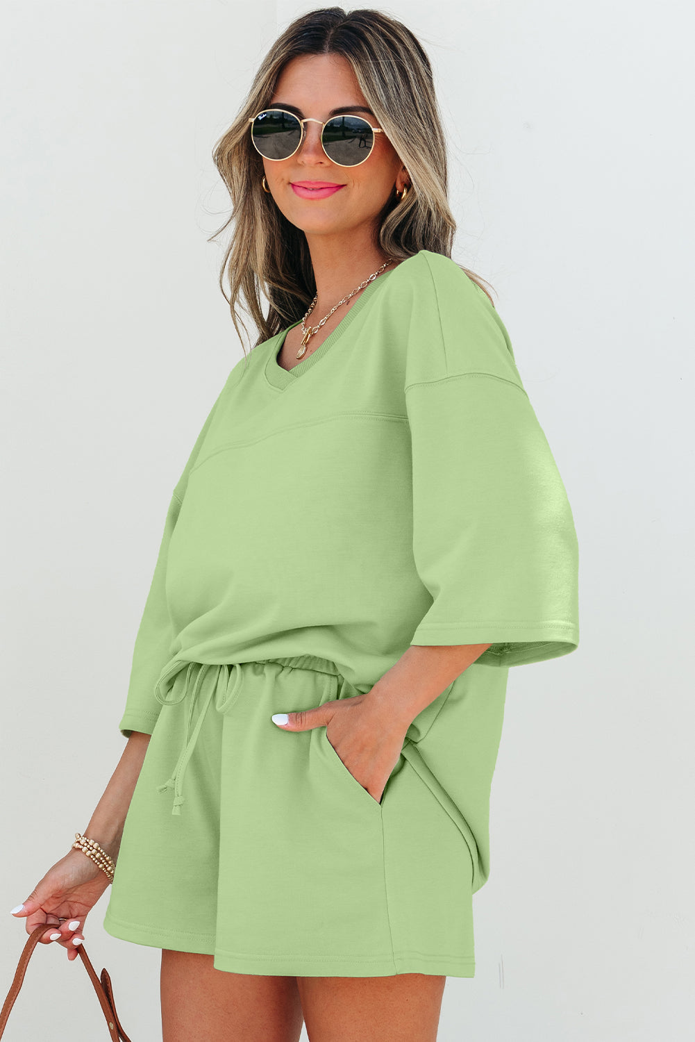 Meadow Mist Green Solid Loose V-Neck Half Sleeve Tee and Shorts