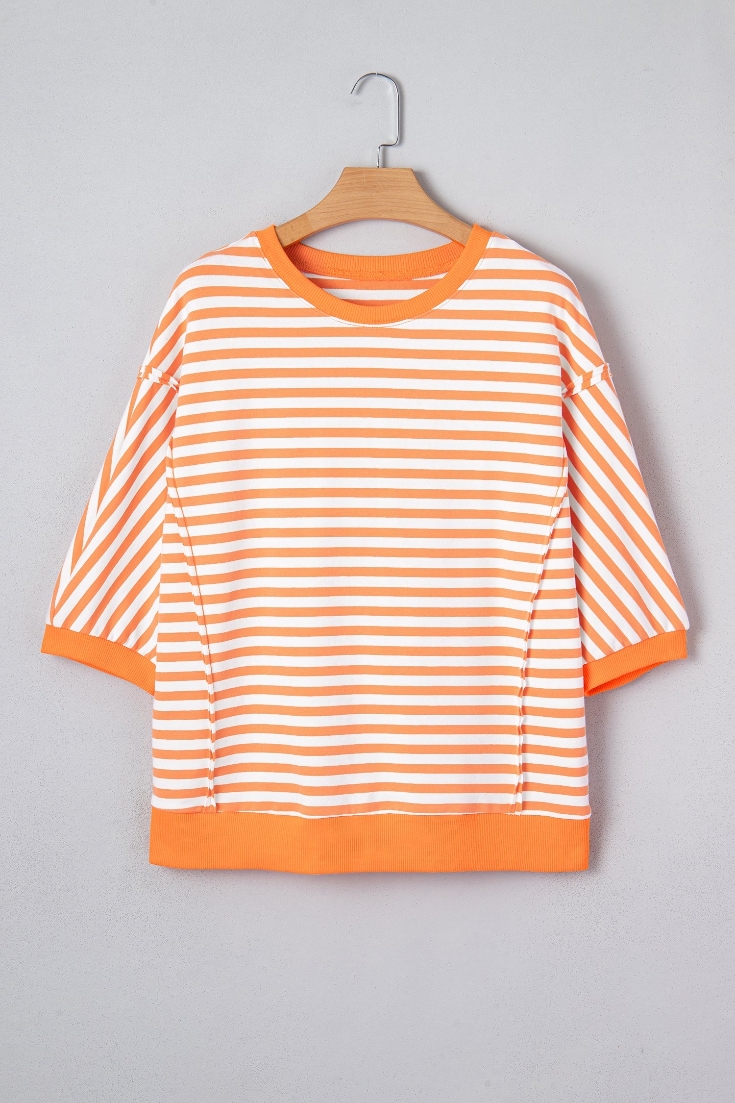 3/4 Sleeve Stripe Sleeve Exposed Seam Pullover Top in Orange