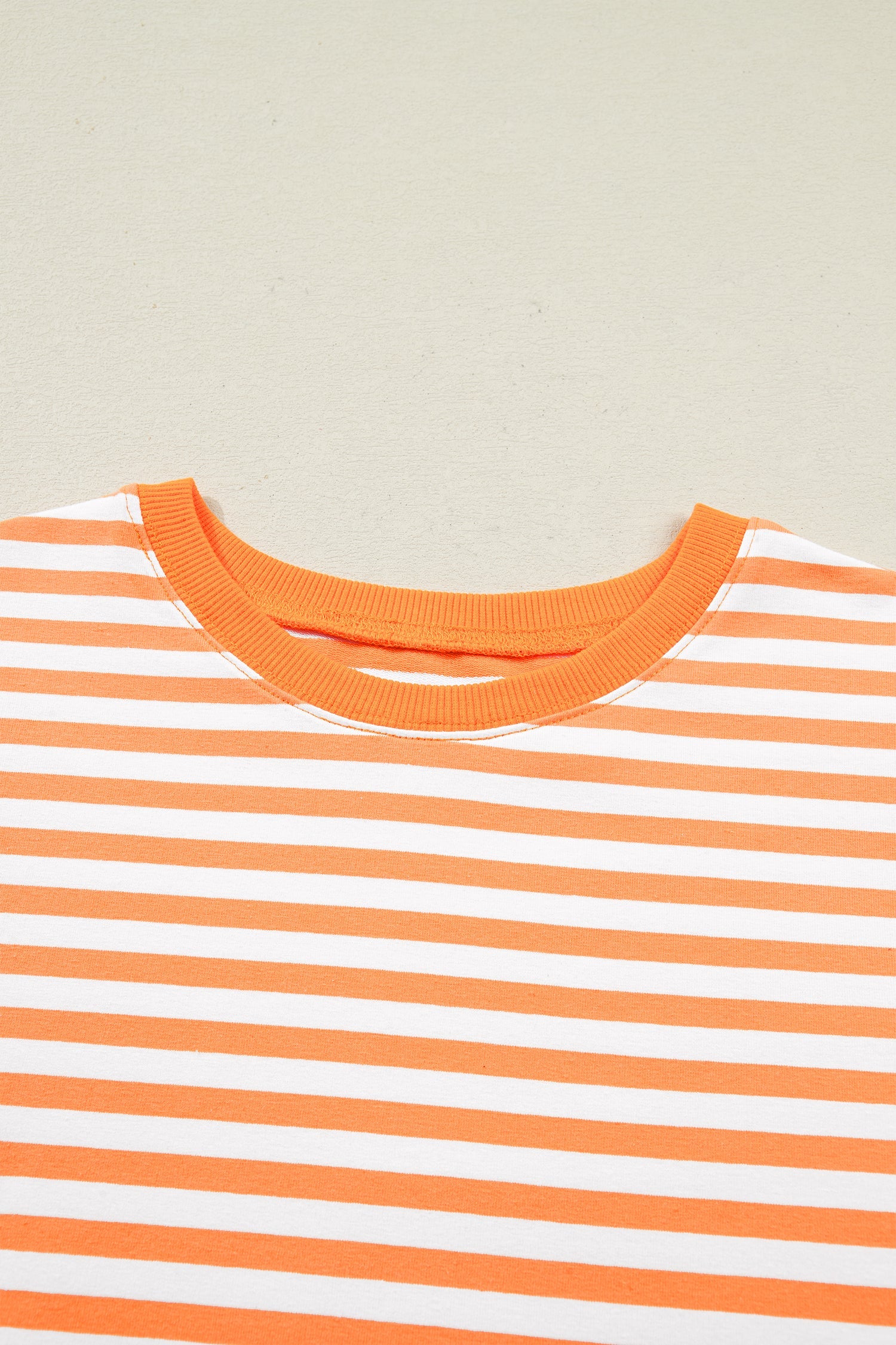 3/4 Sleeve Stripe Sleeve Exposed Seam Pullover Top in Orange