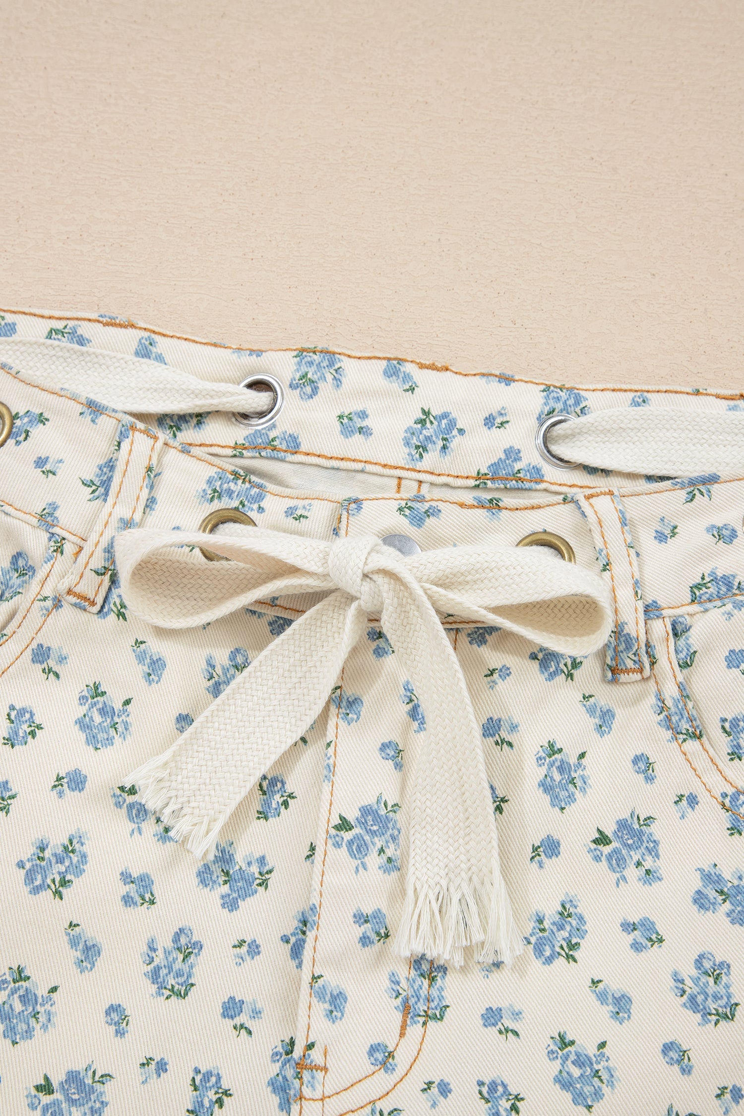 Grommet Knot Waist Floral Barrel Leg Jeans in Beige