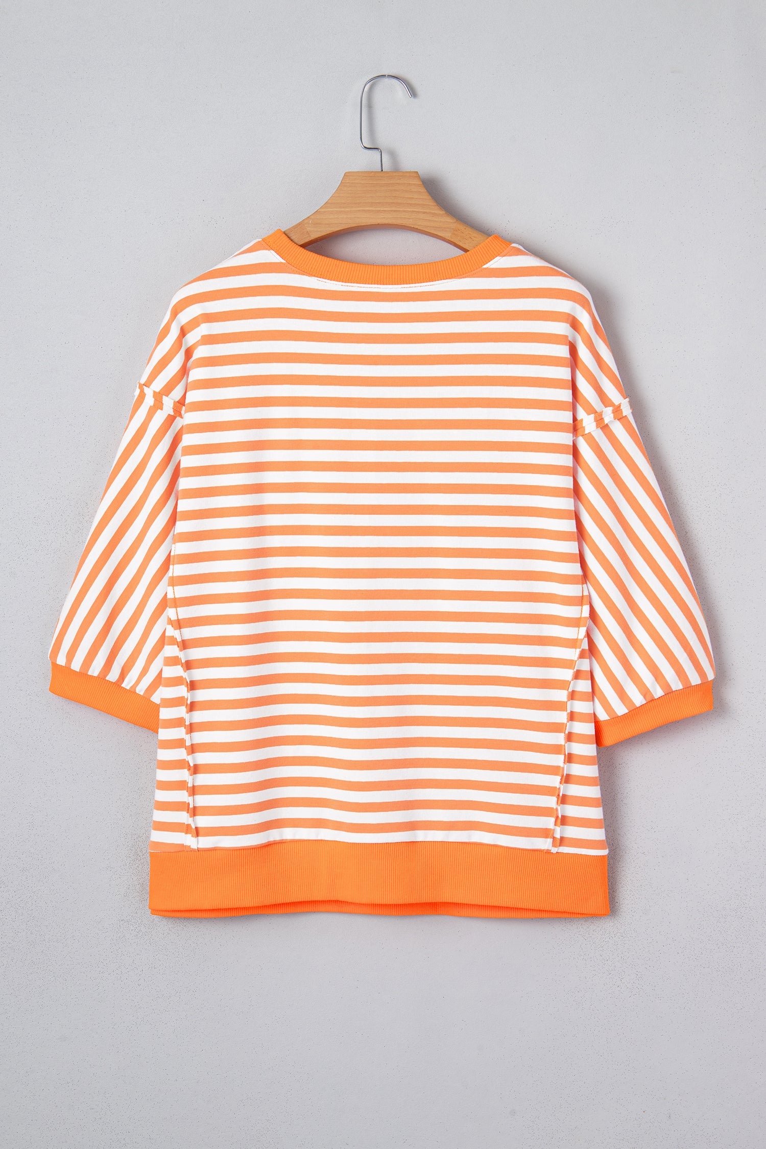 3/4 Sleeve Stripe Sleeve Exposed Seam Pullover Top in Orange