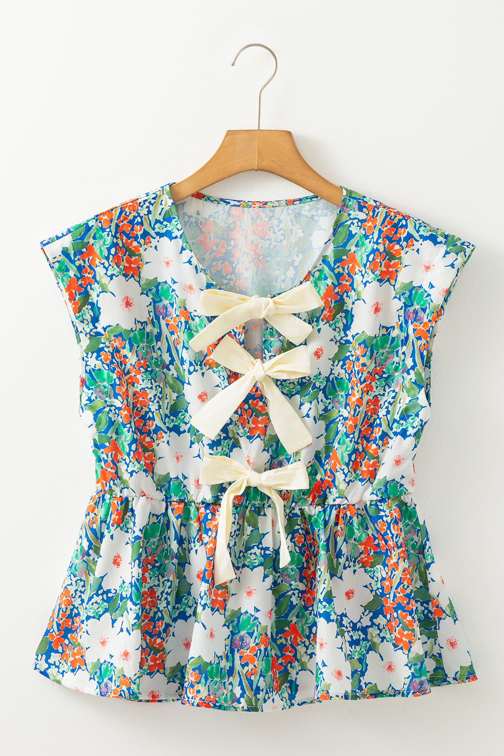 Bow Applique Floral-Print Applique Slit Sleeveless Peplum Blouse