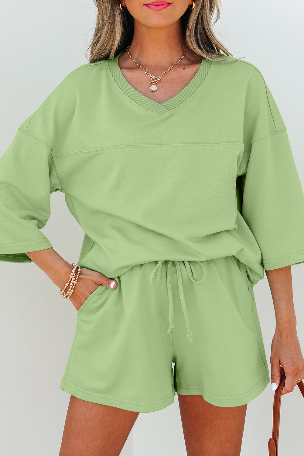 Meadow Mist Green Solid Loose V-Neck Half Sleeve Tee and Shorts
