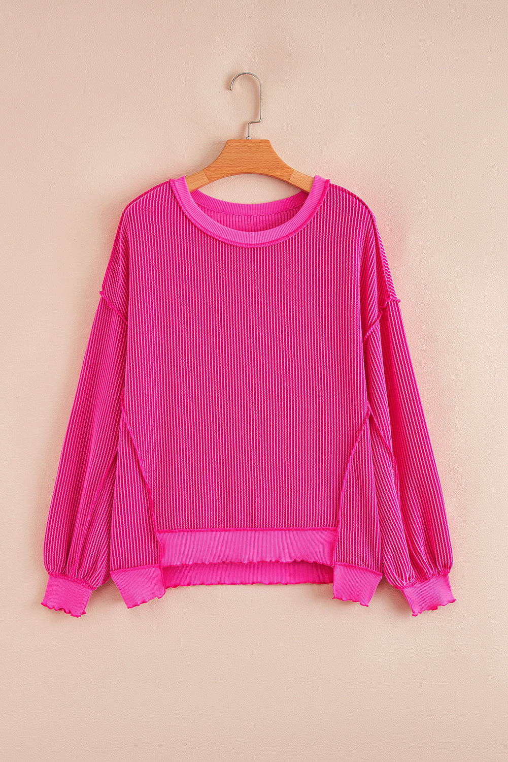 Uneven Twisted Rib Hem Drop-Shoulder Loose Knit Top in Pink