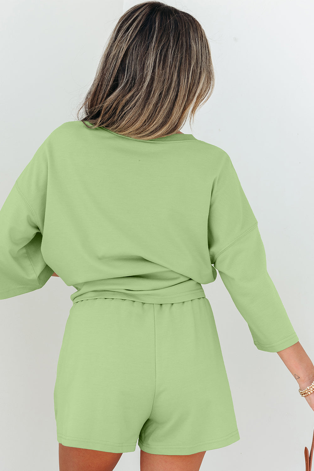 Meadow Mist Green Solid Loose V-Neck Half Sleeve Tee and Shorts