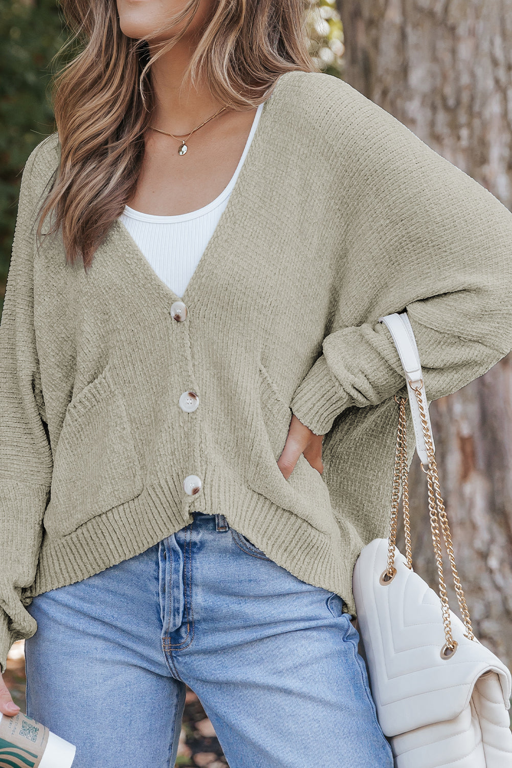 Cardigan pull avec poches sur le devant et boutons