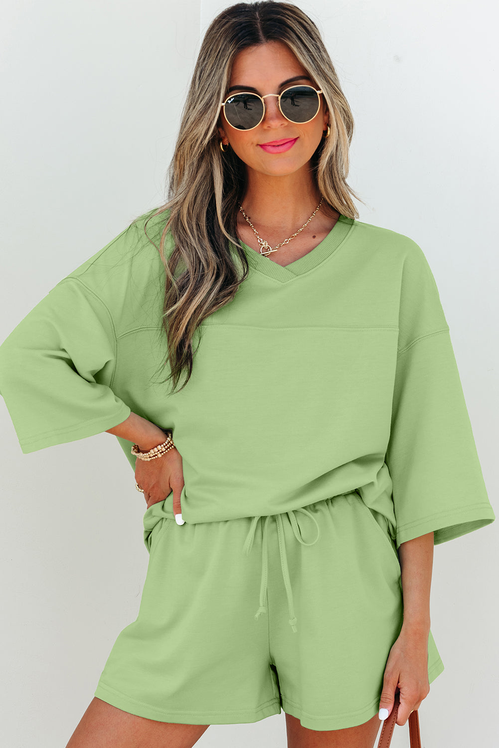 Meadow Mist Green Solid Loose V-Neck Half Sleeve Tee and Shorts
