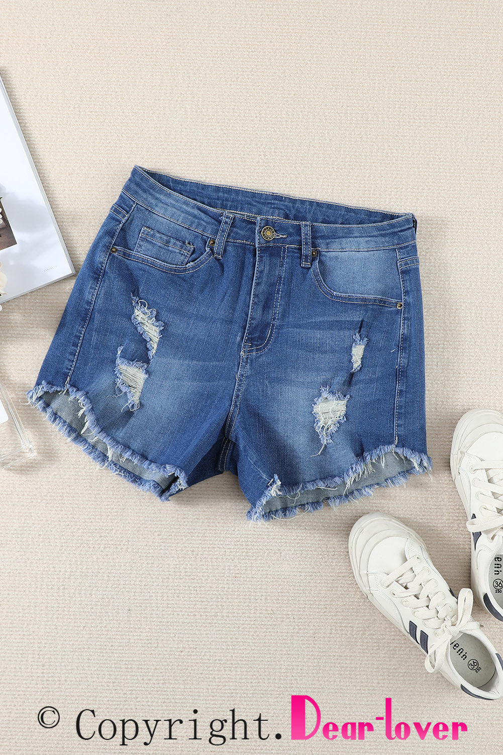 Short en jean bleu foncé à ourlet effiloché