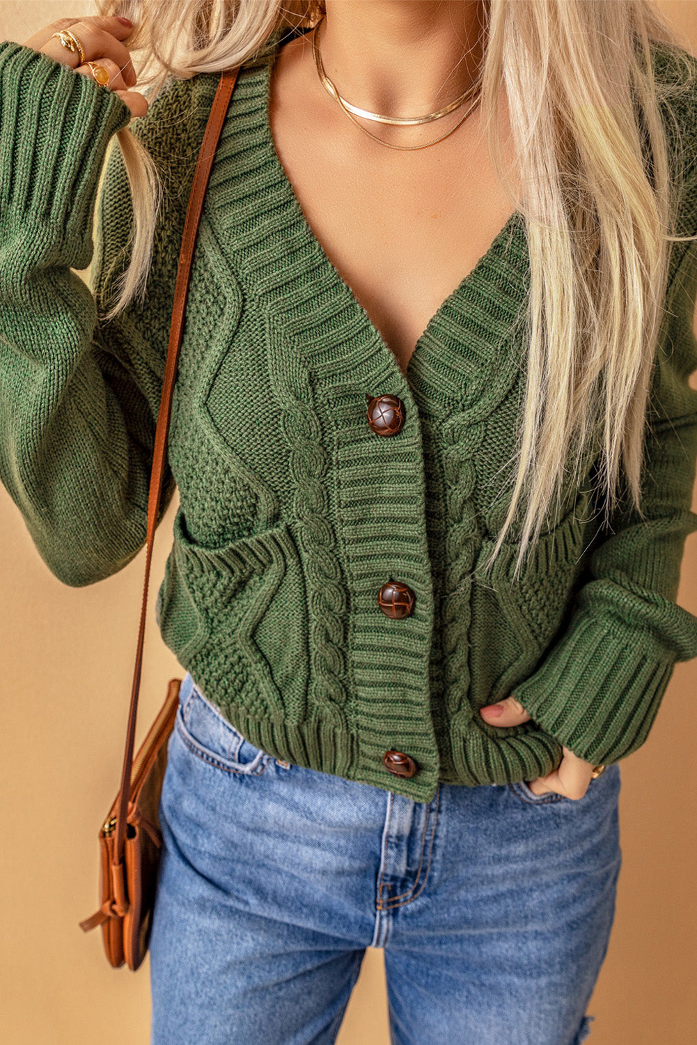 Cardigan texturé vert avec poches avant et boutons