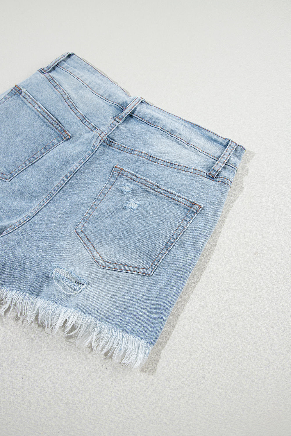 Raw Distressed Ripped Hem High-Waisted Denim Shorts in Light Blue