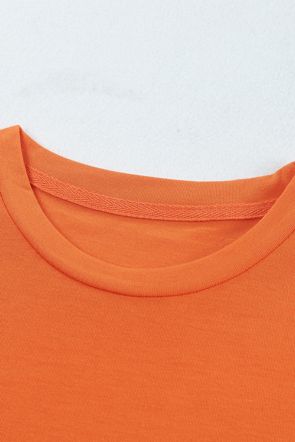 T-shirt orange à col rond de couleur unie