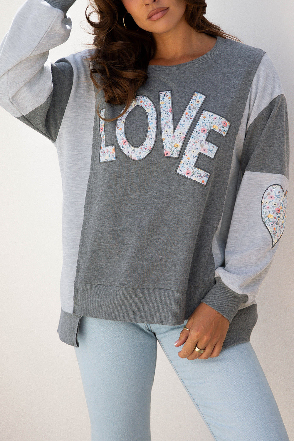 LOVE Graphic Exposed Seam Patchwork Uneven Hem Polished Sweatshirt