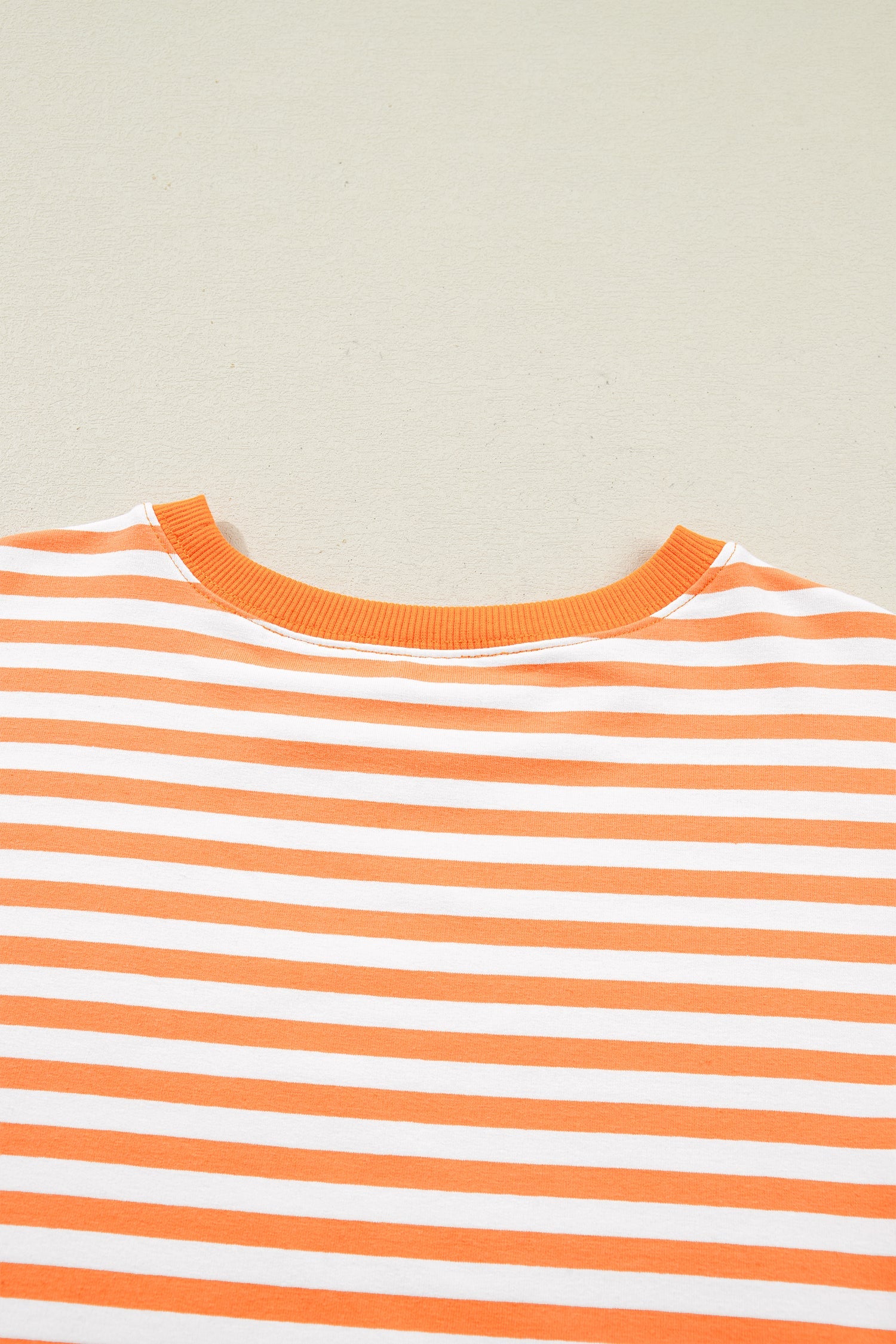 3/4 Sleeve Stripe Sleeve Exposed Seam Pullover Top in Orange