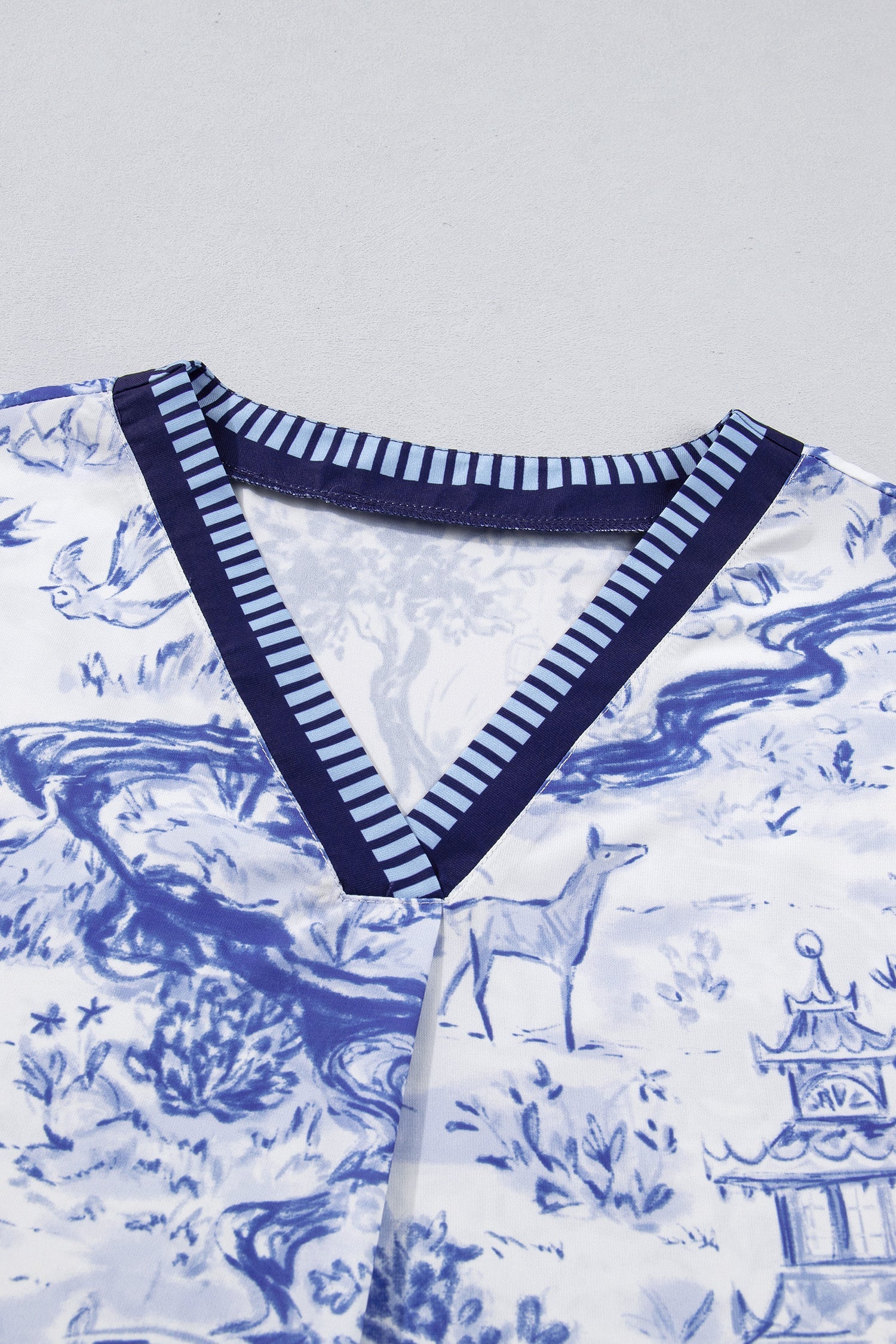 Animal Paradise Wild Paradise Striped Trim V-Neck Short-Sleeved Blouse in Blue