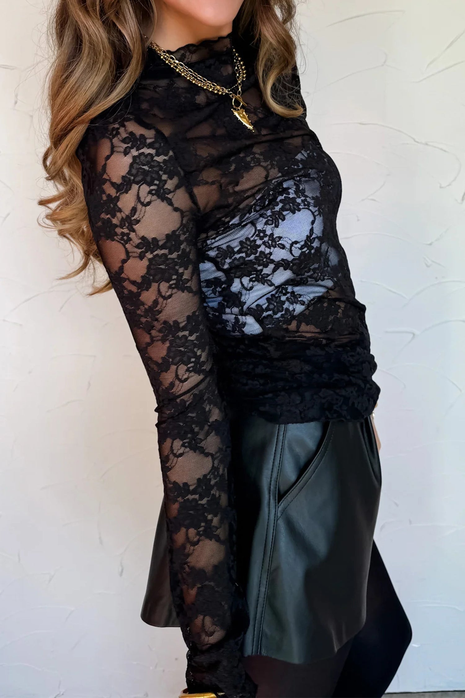 Lace Sheer Floral Lettuce Trim Mock-Neck Long-Sleeved Top in Black
