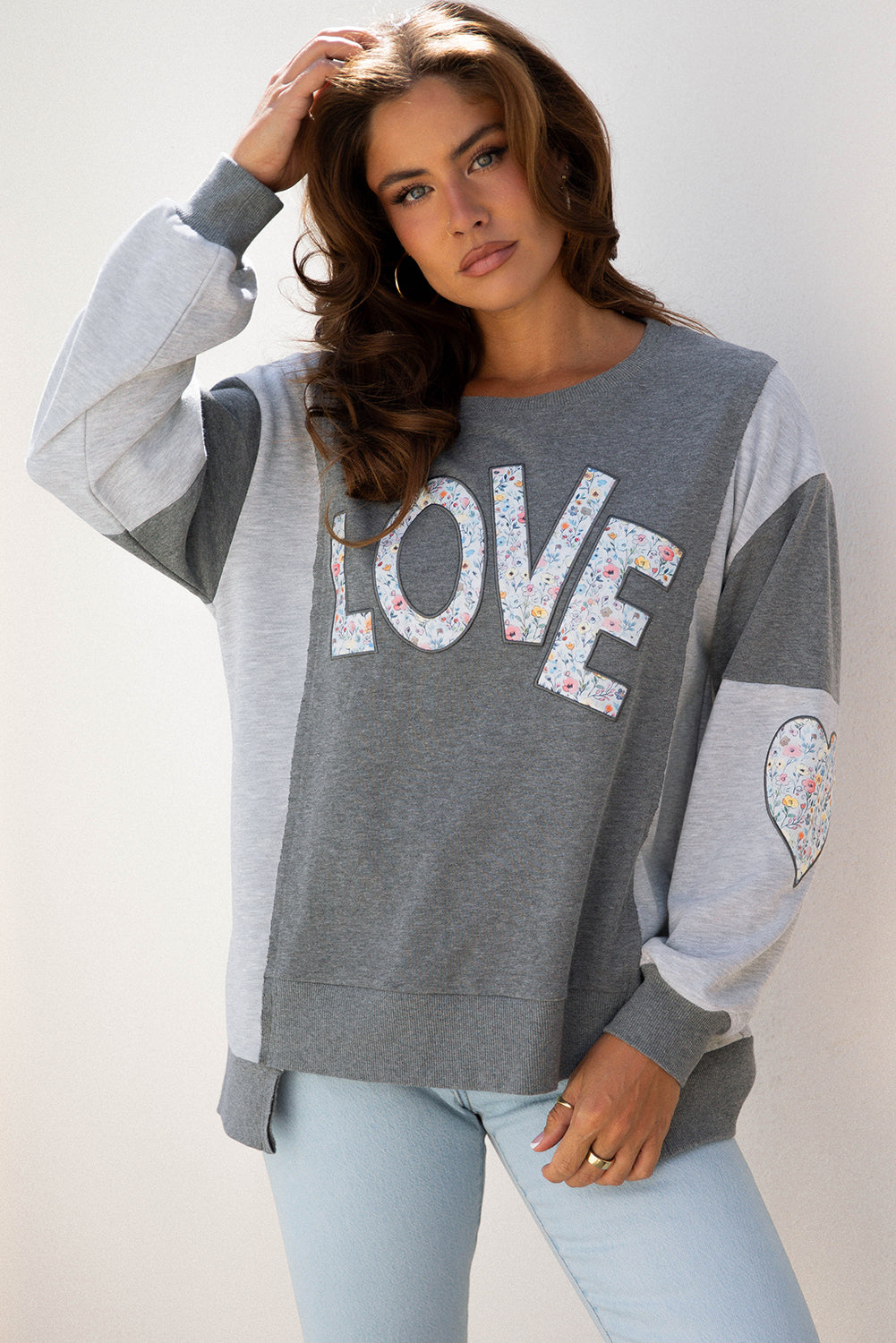 LOVE Graphic Exposed Seam Patchwork Uneven Hem Polished Sweatshirt