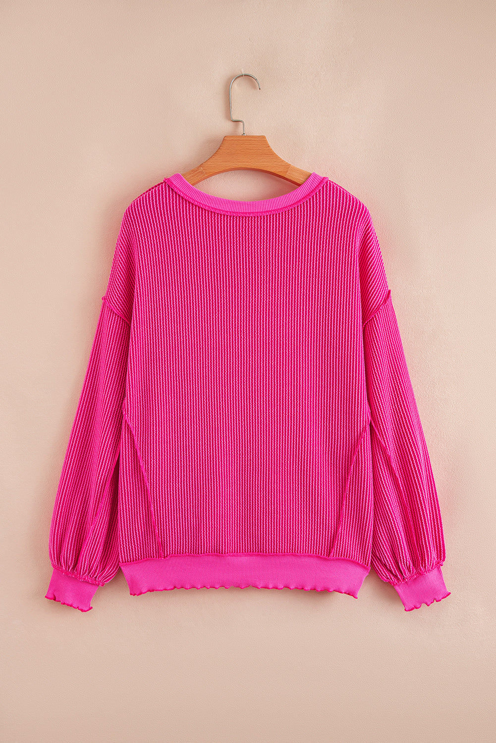 Uneven Twisted Rib Hem Drop-Shoulder Loose Knit Top in Pink