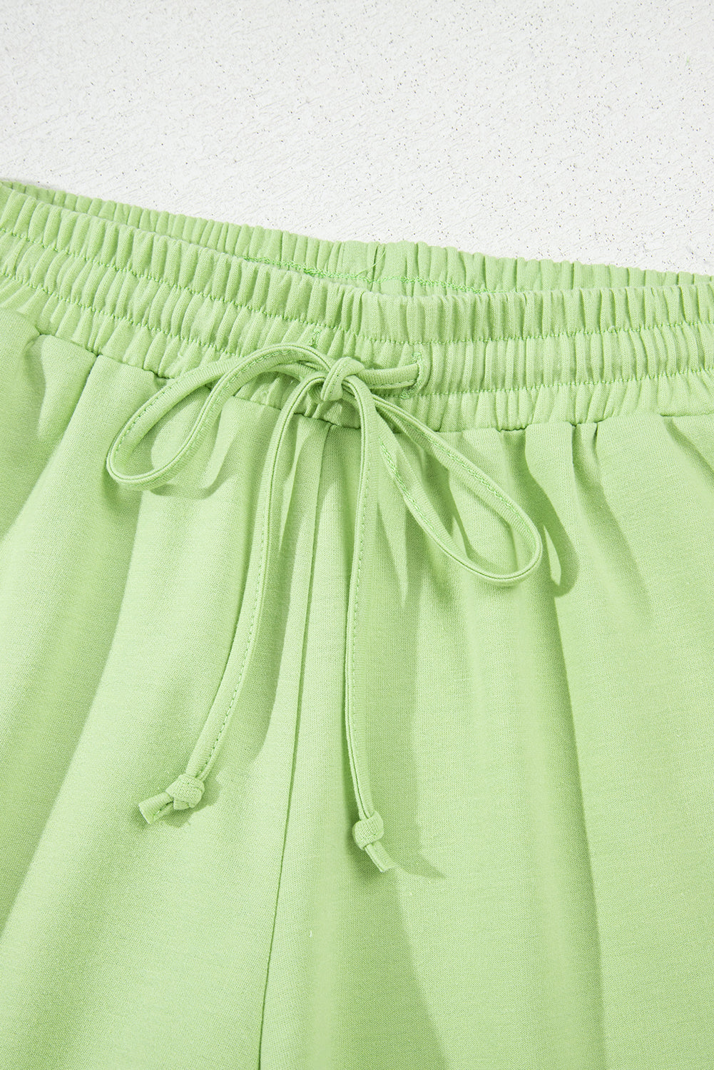 Meadow Mist Green Solid Loose V-Neck Half Sleeve Tee and Shorts