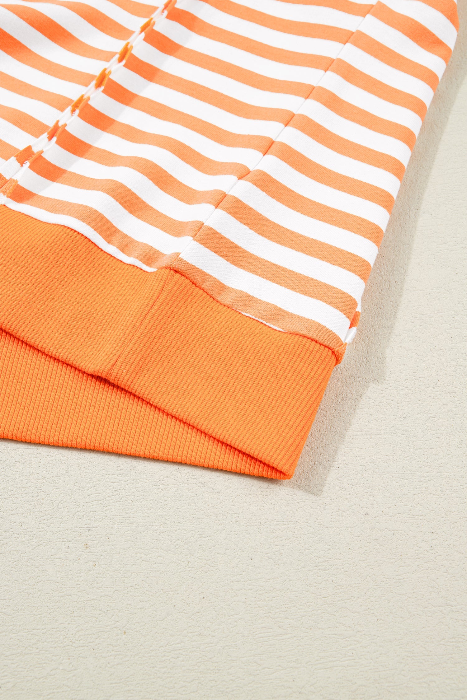 3/4 Sleeve Stripe Sleeve Exposed Seam Pullover Top in Orange