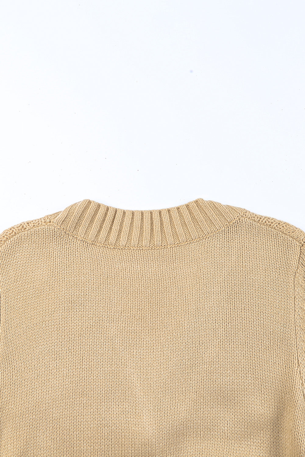 Cardigan texturé beige avec poches avant et boutons