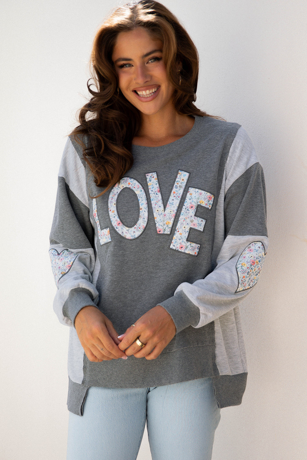 LOVE Graphic Exposed Seam Patchwork Uneven Hem Polished Sweatshirt