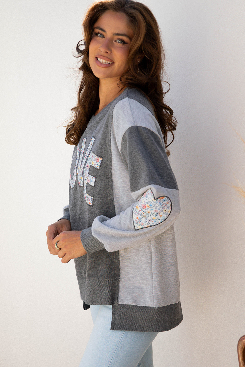 LOVE Graphic Exposed Seam Patchwork Uneven Hem Polished Sweatshirt