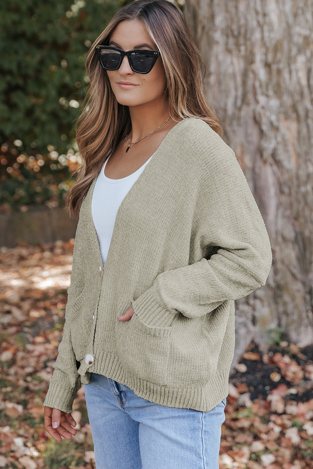 Cardigan pull avec poches sur le devant et boutons