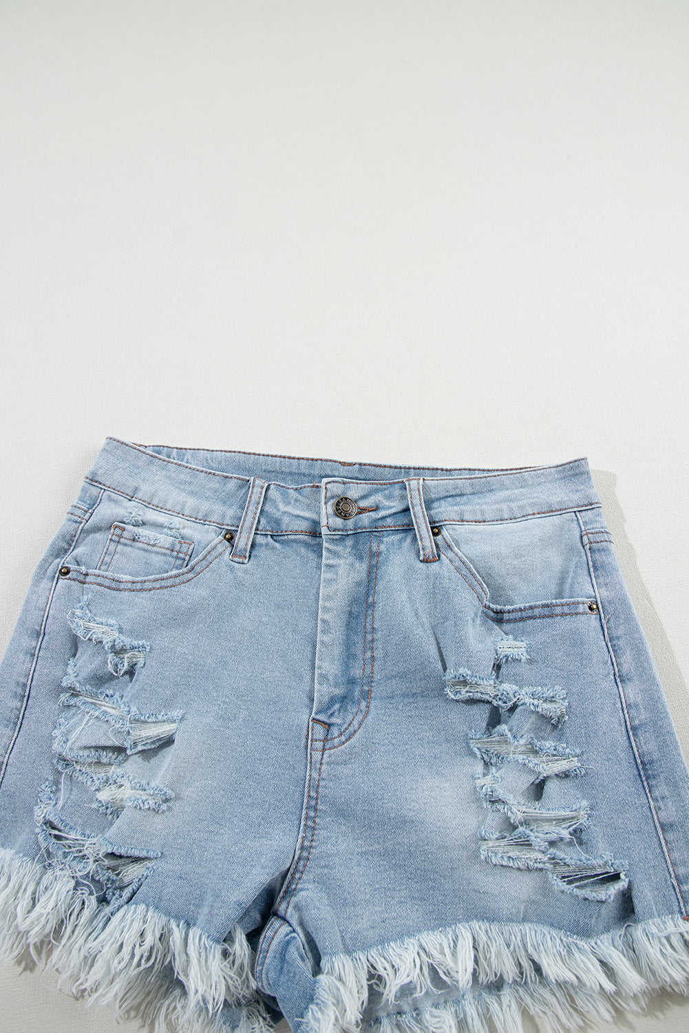 Raw Distressed Ripped Hem High-Waisted Denim Shorts in Light Blue